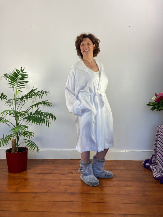 woman smiling at camera in white gown - some of the best women's nightwear