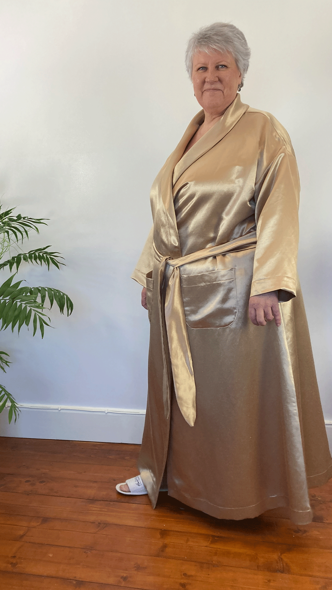 Woman in floor length golden gown - older ladies nightwear to help with hot flushes