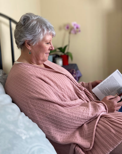 Women relaxing reading book wearing luxury women's sleepwear - designed for women in menopause and hot flushes