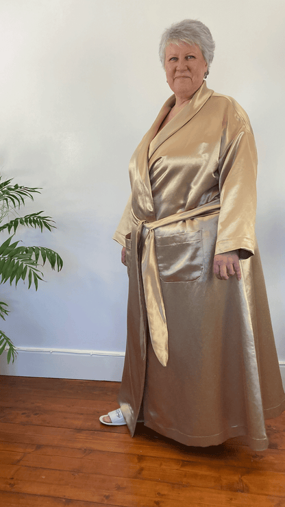 Woman in floor length golden gown - older ladies nightwear to help with hot flushes